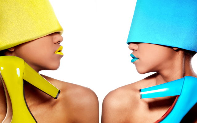 Two women with bright hats and holding shoes for fashion translation and copywriting of products for E-commerce
