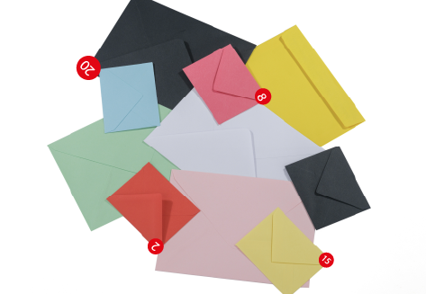 Colorful envelopes of different sizes representing global email communication styles across cultures in business.